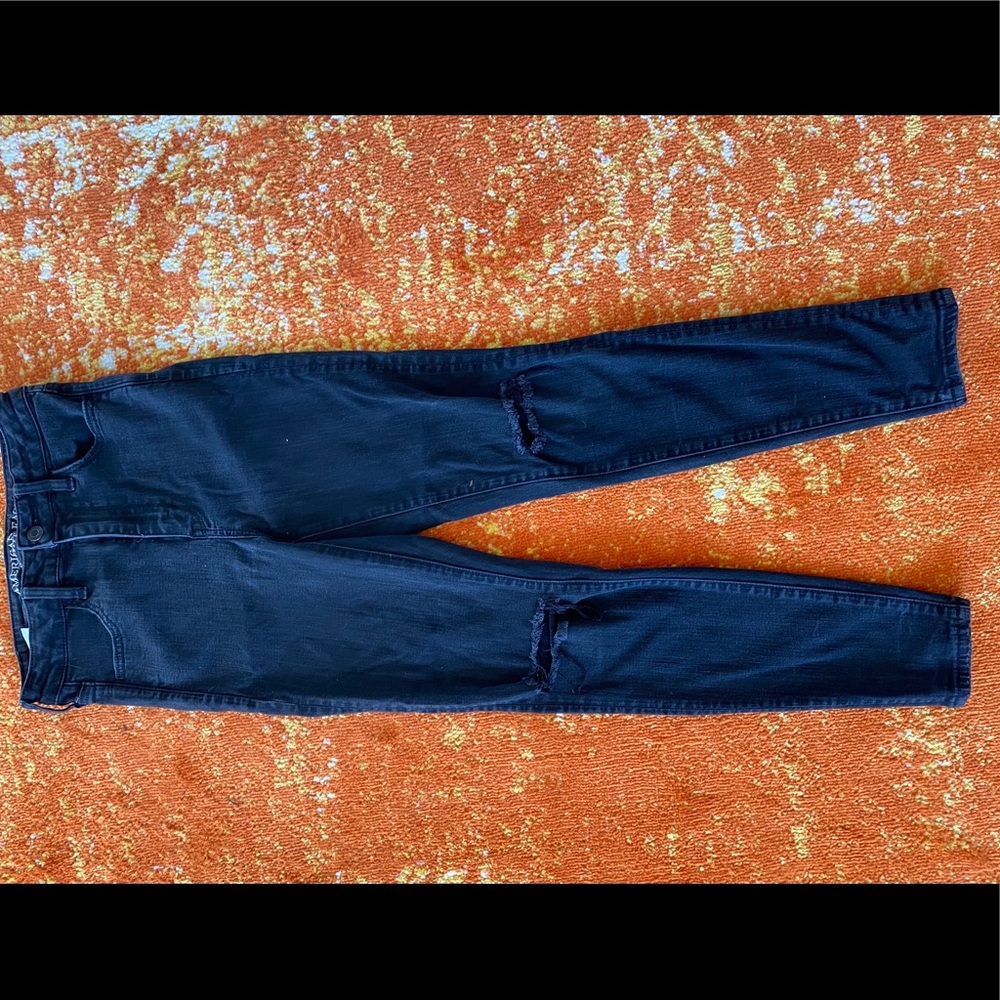 American Eagle black jeggings with rips in knees